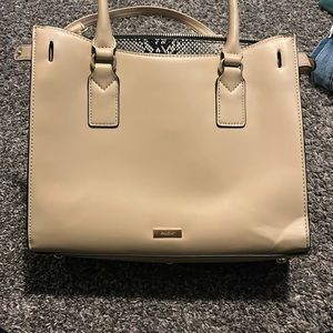 I am selling a Aldo purse. Tan color with snake skin.